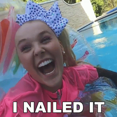 A Girl With A Bow On Her Head Is Laughing In A Pool With The Words `` I Nailed It '' Below Her . GIF