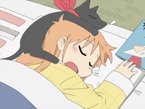 A Girl With A Cat On Her Head Sleeping Next To A Book GIF