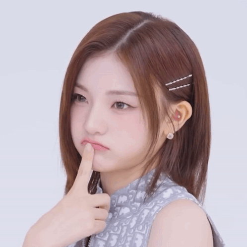 A Girl With A Dior Shirt On Is Making A Face GIF
