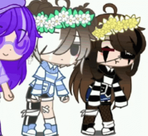 A Girl With A Flower Crown On Her Head Is Standing Next To Two Other Girls . GIF