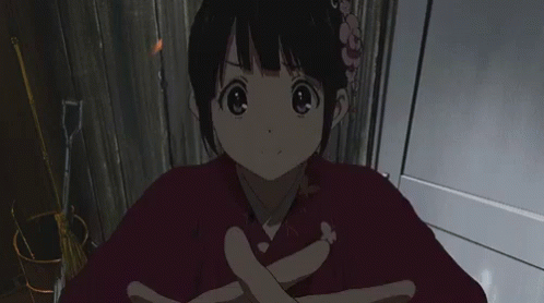 A Girl With A Flower In Her Hair Is Wearing A Kimono GIF