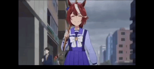 a girl with a horse on her head is walking down a city street .
