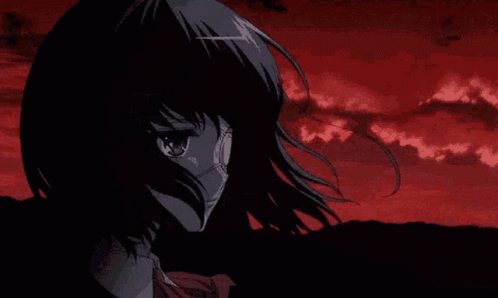 A Girl With A Mask On Her Face Is Crying In Front Of A Red Sky . GIF