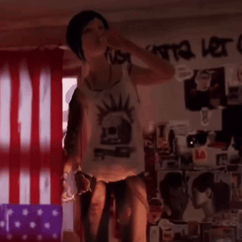 A Girl With A Mohawk On Her Back Is Being Lifted By A Man GIF