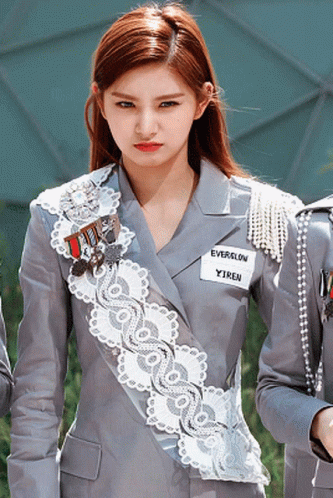 A Girl With A Name Tag That Says Everglow GIF