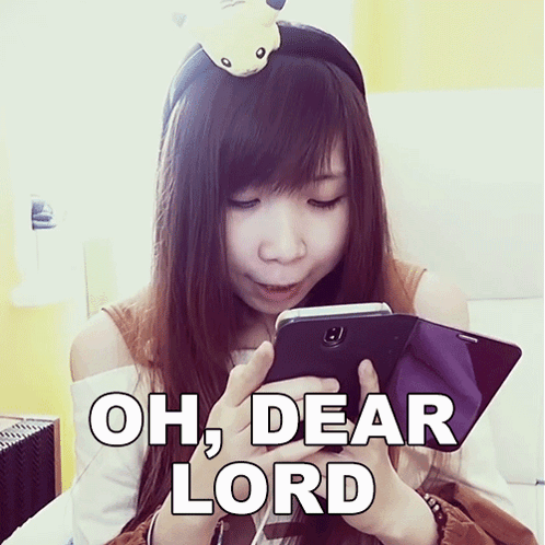 A Girl With A Pikachu Headband Is Looking At Her Phone With The Words Oh Dear Lord Written Below Her GIF