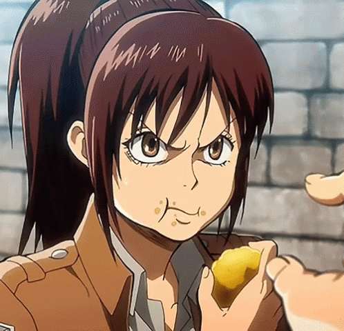 A Girl With A Ponytail Is Eating A Piece Of Food From A Person 'S Hand GIF