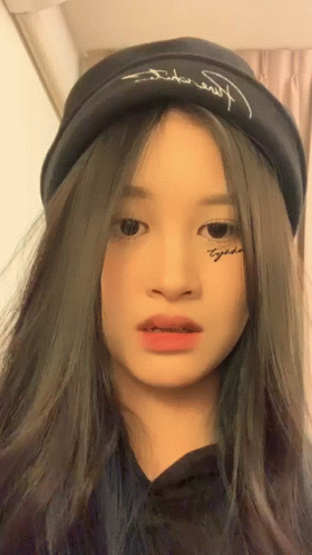 A Girl With A Tattoo On Her Face Has The Word Together On It GIF