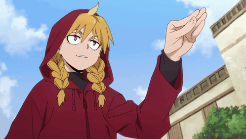 a girl with blonde braids wearing a red jacket with a hood is standing in front of a building