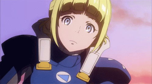 A Girl With Blonde Hair And Blue Eyes Is Wearing A Blue And Yellow Outfit With A White Triangle On The Chest GIF