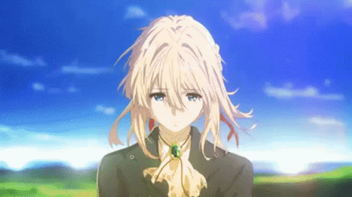 a girl with blonde hair and blue eyes is wearing a suit and tie and standing in a field .
