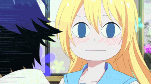 A Girl With Blonde Hair And Blue Eyes Making A Face GIF