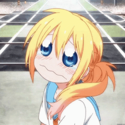 A Girl With Blonde Hair And Blue Eyes Making A Funny Face GIF