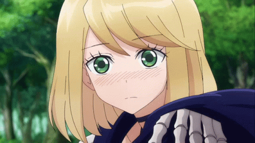 A Girl With Blonde Hair And Green Eyes Is Holding A Skeleton Arm GIF