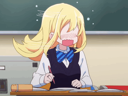 A Girl With Blonde Hair Is Sitting At A Desk Holding A Pen GIF