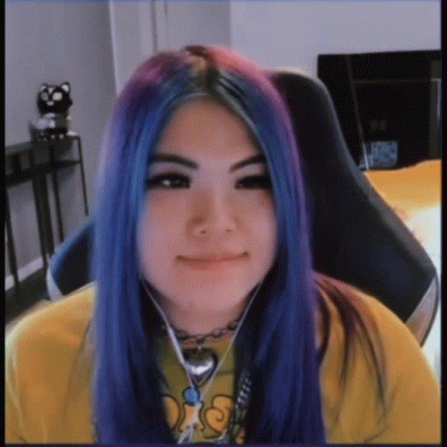 A Girl With Blue And Purple Hair Is Wearing A Yellow Shirt That Says Ds GIF
