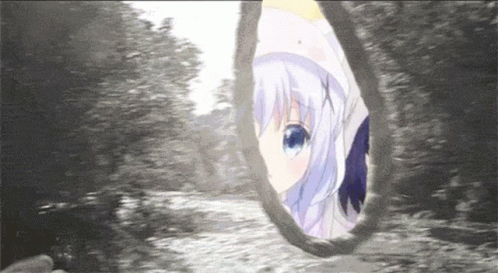 a girl with blue eyes is looking out of a hole in the ground