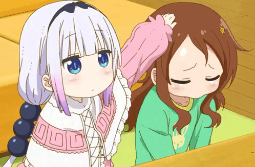 A Girl With Blue Eyes Is Petting Another Girl 'S Head While Another Girl Looks Down GIF