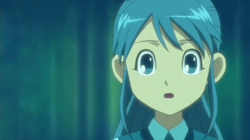 A Girl With Blue Hair And A Blue Shirt And Tie GIF