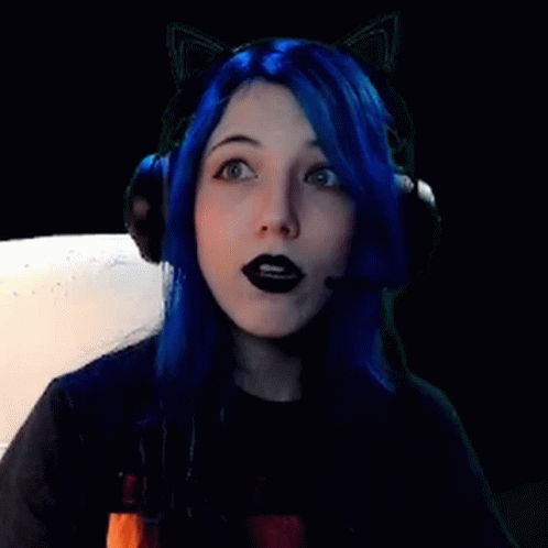 A Girl With Blue Hair And Black Lipstick Is Wearing Headphones And Cat Ears . GIF