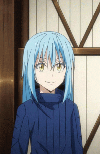 A Girl With Blue Hair And Brown Eyes Is Smiling GIF
