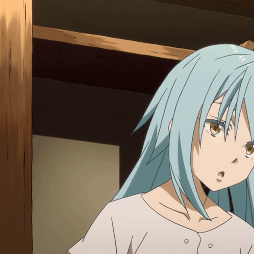 A Girl With Blue Hair And Brown Eyes Is Standing In A Room GIF