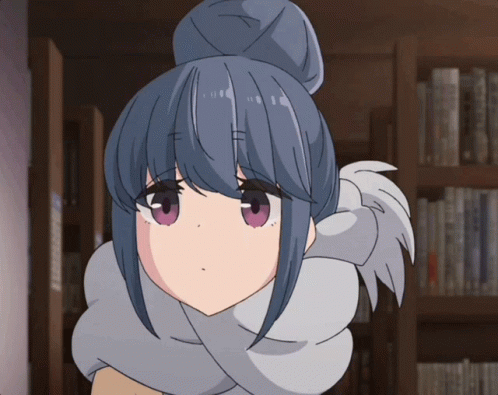 A Girl With Blue Hair And Purple Eyes Is Standing In Front Of A Bookshelf GIF