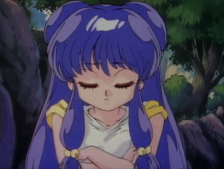 A Girl With Blue Hair Has Her Eyes Closed And Is Wearing A White Shirt GIF