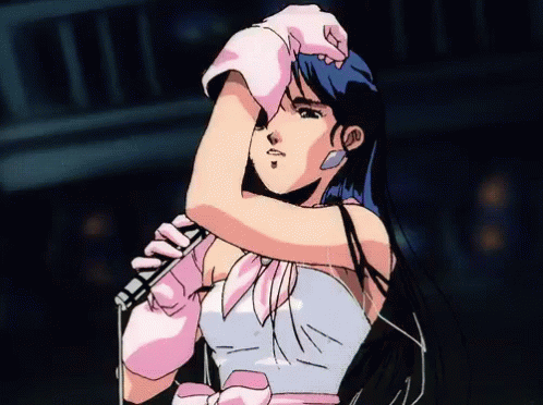 A Girl With Blue Hair Is Holding A Microphone GIF