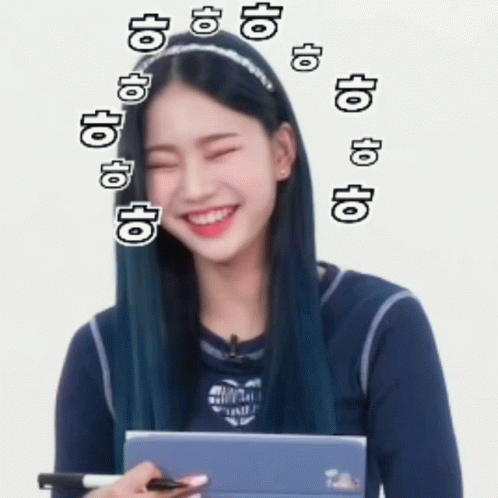 A Girl With Blue Hair Is Smiling And Holding A Tablet GIF