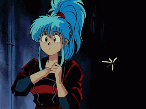 A Girl With Blue Hair Is Spraying Something In A Can GIF