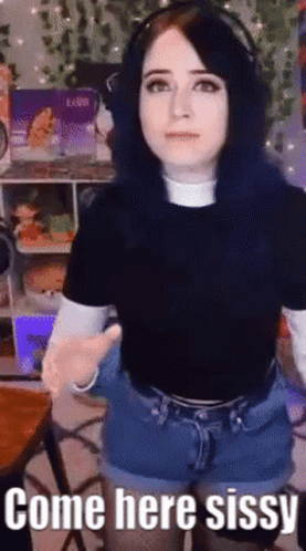 A Girl With Blue Hair Is Wearing Headphones And Shorts And Says Come Here Sissy . GIF