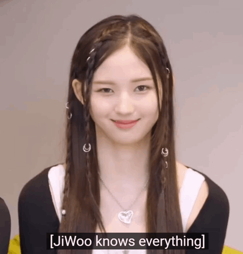 A Girl With Braids And A Necklace Says Jiwoo Knows Everything . GIF