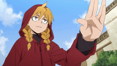 a girl with braids is wearing a red hoodie and making a stop sign