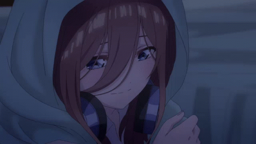 A Girl With Brown Hair And Blue Eyes Is Wearing A Hooded Jacket GIF