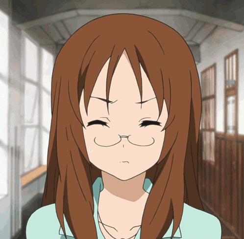 A Girl With Brown Hair And Glasses Is Making A Face GIF