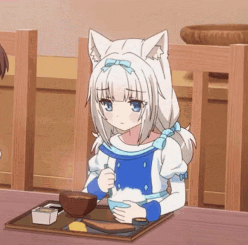 A Girl With Cat Ears Is Sitting At A Table Eating Rice . GIF