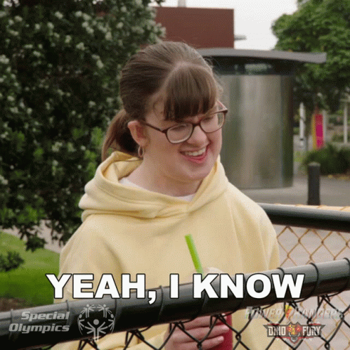 A Girl With Glasses And A Yellow Hoodie Says " Yeah , I Know " GIF