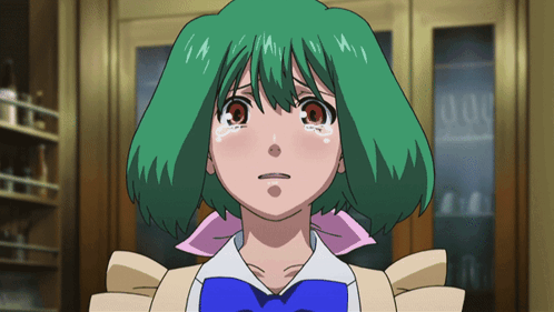 A Girl With Green Hair And A Blue Bow Tie Looks Sad GIF