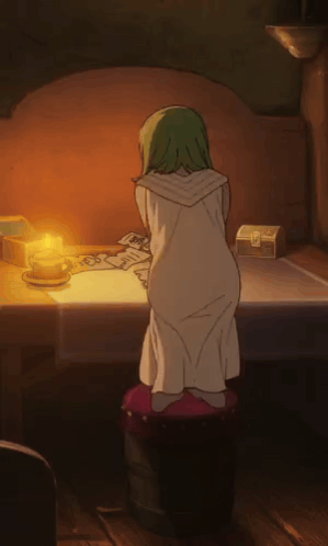 A Girl With Green Hair Is Kneeling In Front Of A Table GIF