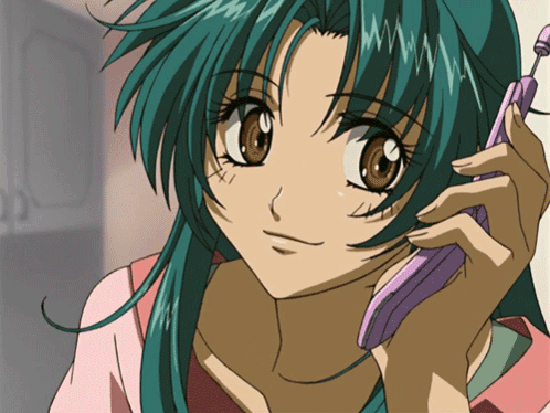 A Girl With Green Hair Is Talking On A Cellphone GIF