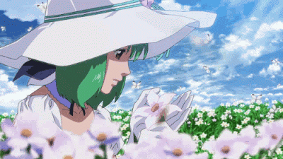 A Girl With Green Hair Wearing A White Hat And Gloves Smelling A Flower GIF