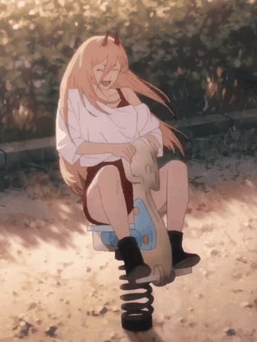 A Girl With Horns Is Sitting On A Seesaw In The Sand GIF