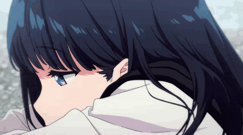 A Girl With Long Black Hair And Blue Eyes Looks Down GIF