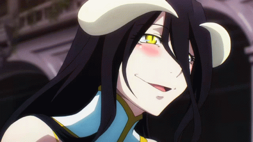 A Girl With Long Black Hair And Horns On Her Head Is Smiling GIF