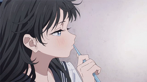 A Girl With Long Black Hair Is Brushing Her Teeth With A Toothbrush . GIF