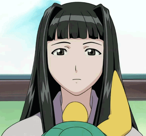 A Girl With Long Black Hair Is Holding A Yellow Object In Her Hand GIF