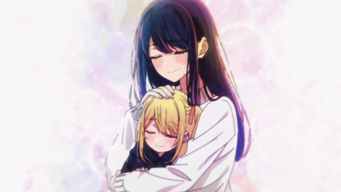 A Girl With Long Black Hair Is Hugging Another Girl GIF