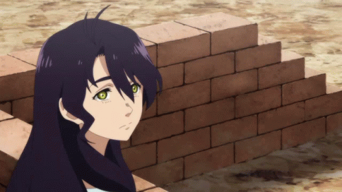 A Girl With Long Black Hair Is Leaning Against A Wall GIF