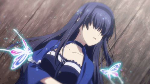 A Girl With Long Black Hair Is Surrounded By Butterfly Wings GIF